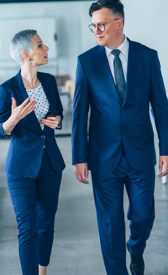 IT specialist consulting with business owner about their cybersecurity.