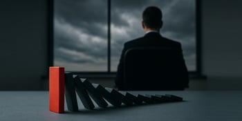 Hero image for One Step Secure It blog post What Happens When Operational Preparedness Fails at the Top? where a CEO stands in the background where his actions have a domino affect.